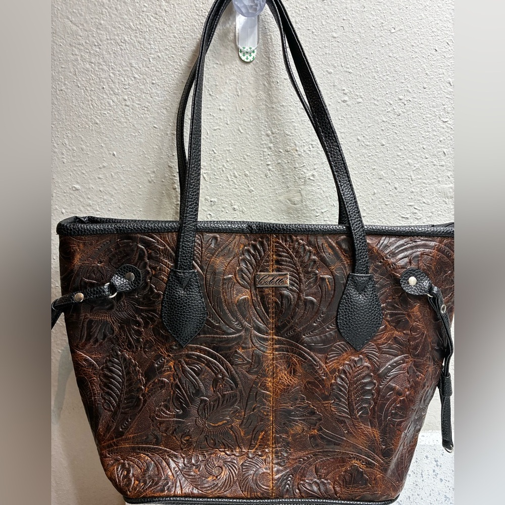 Hand tooled leather handbag by Colette